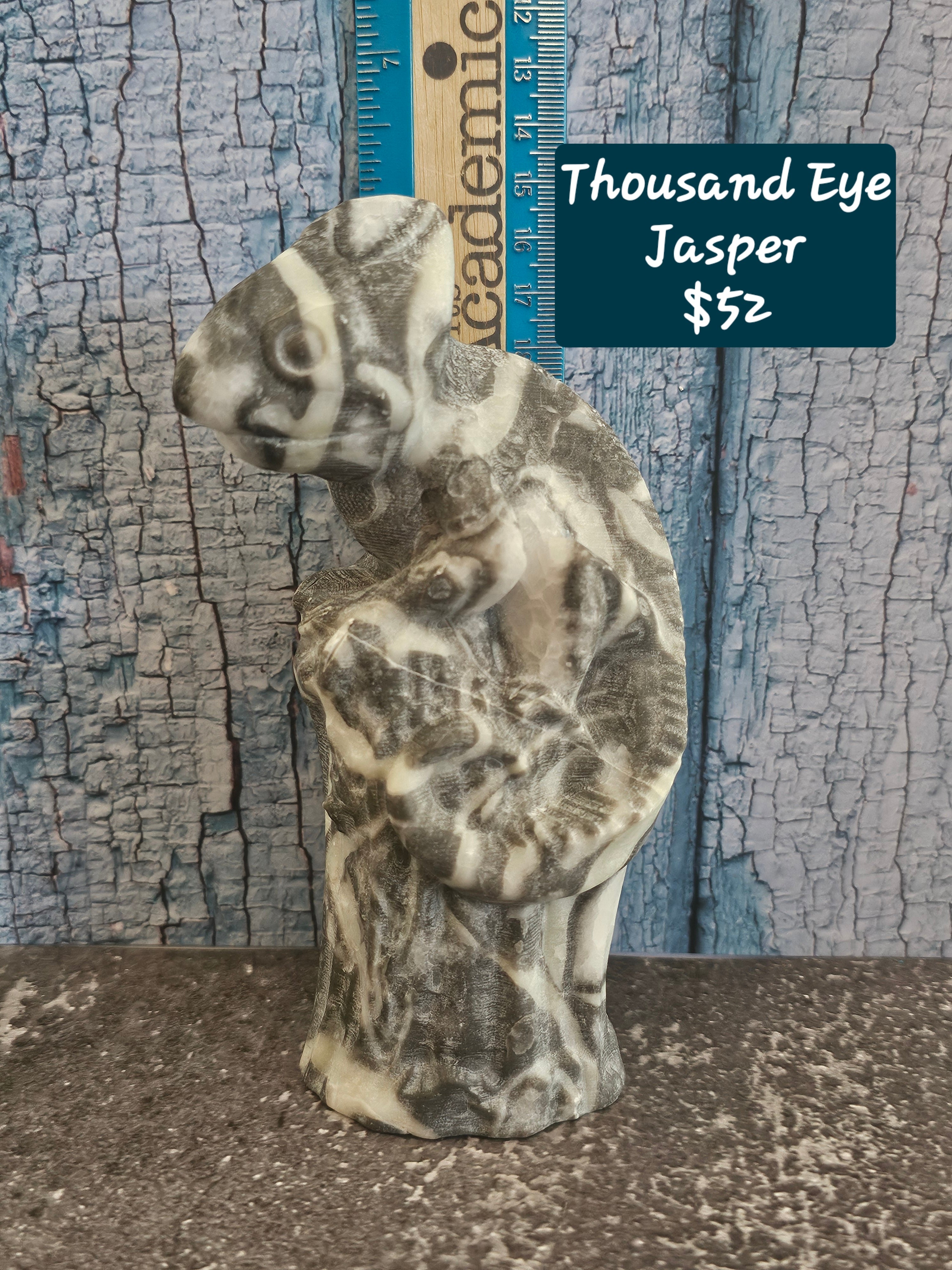 Thousand eye jasper chameleon carving on stump
