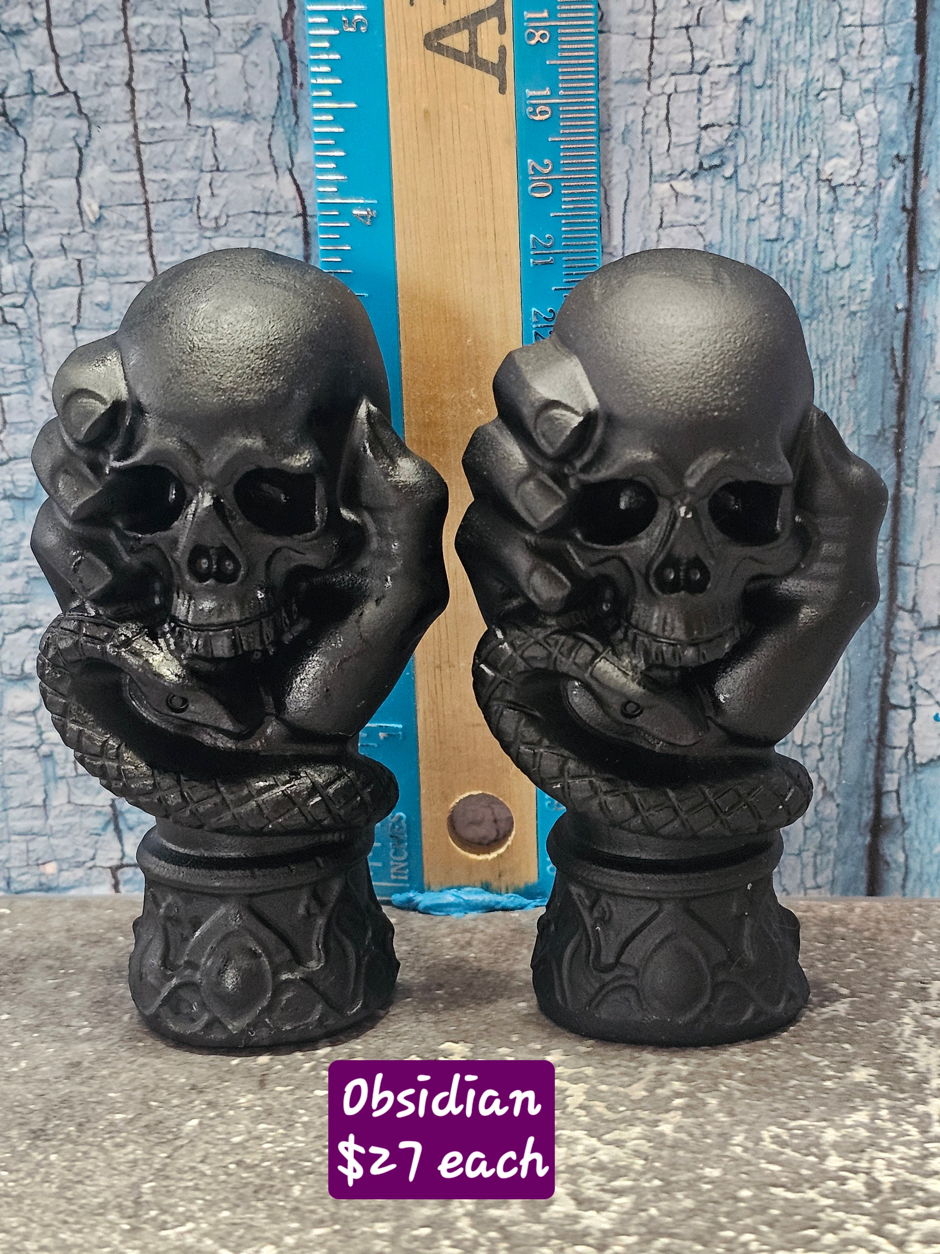 Obsidian Hand Holding Skull