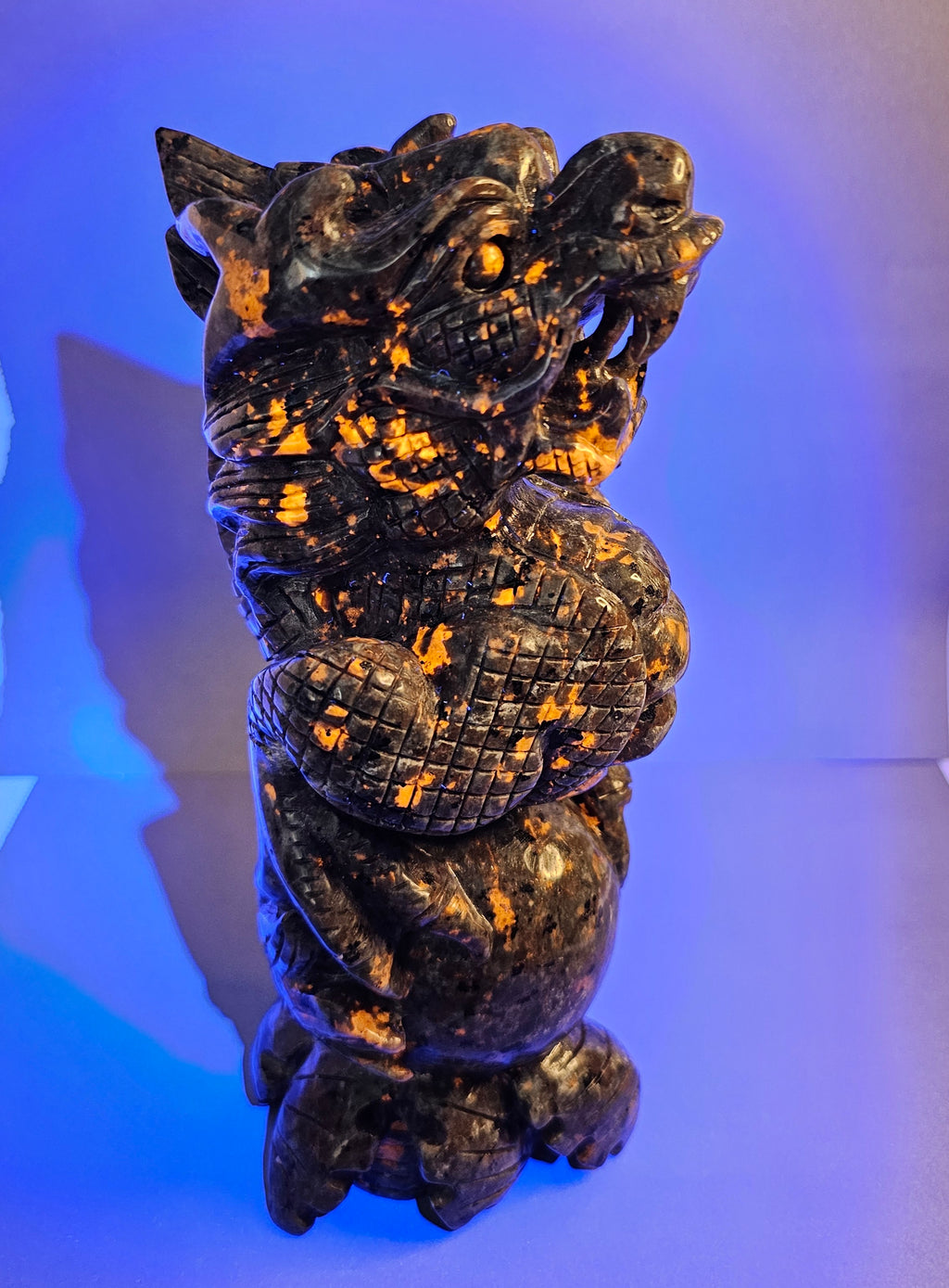 Right side of Emberlite dragon with ball glowing under UV light.