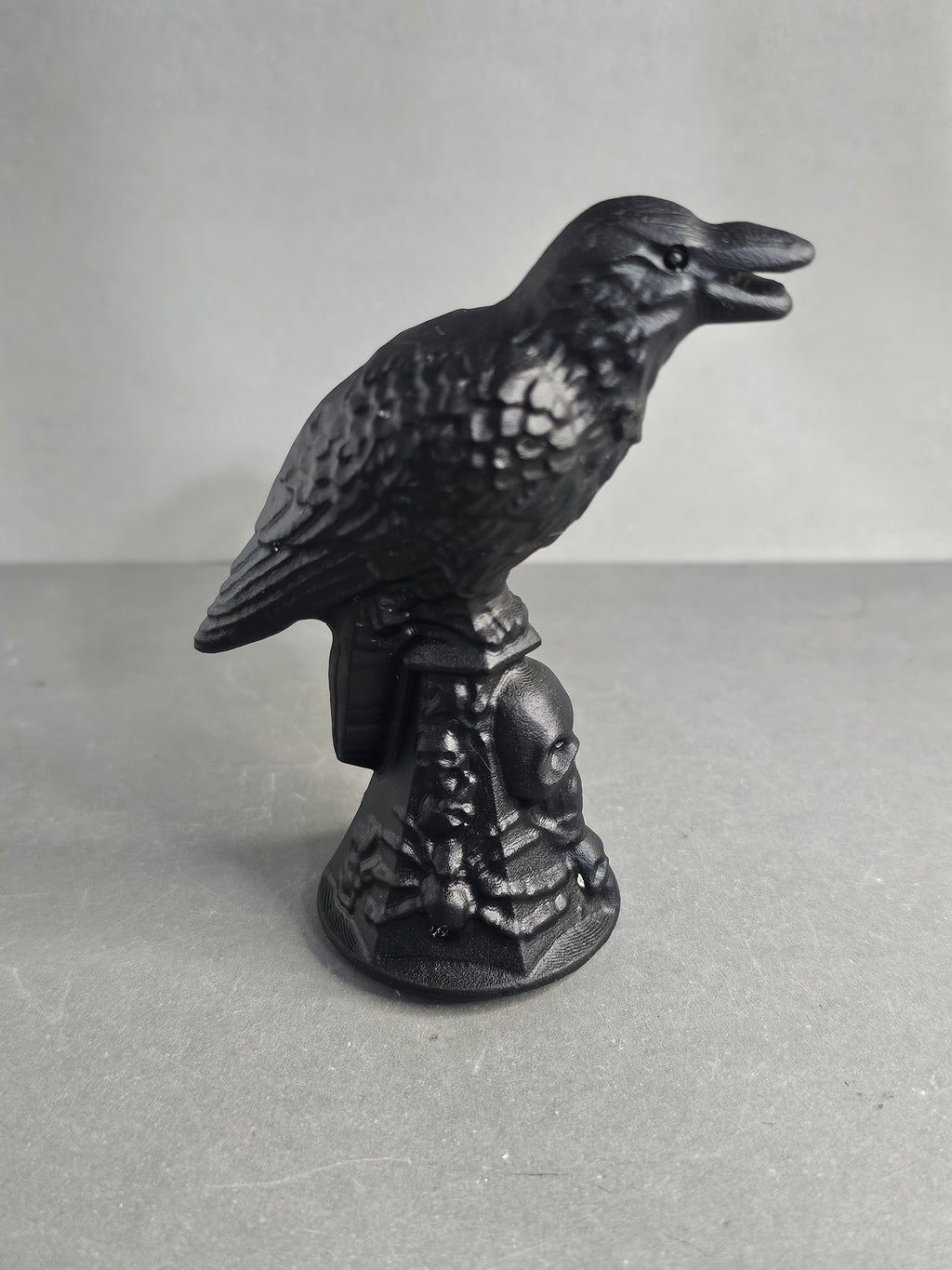 Obsidian Raven on Skull Pedestal – 3.5" Gothic Collector Carving