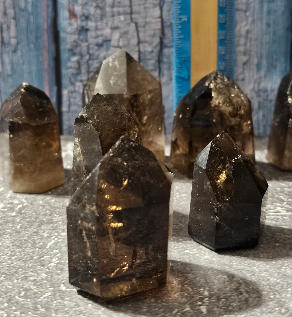 group of dark smokey quartz freeform crystals polished