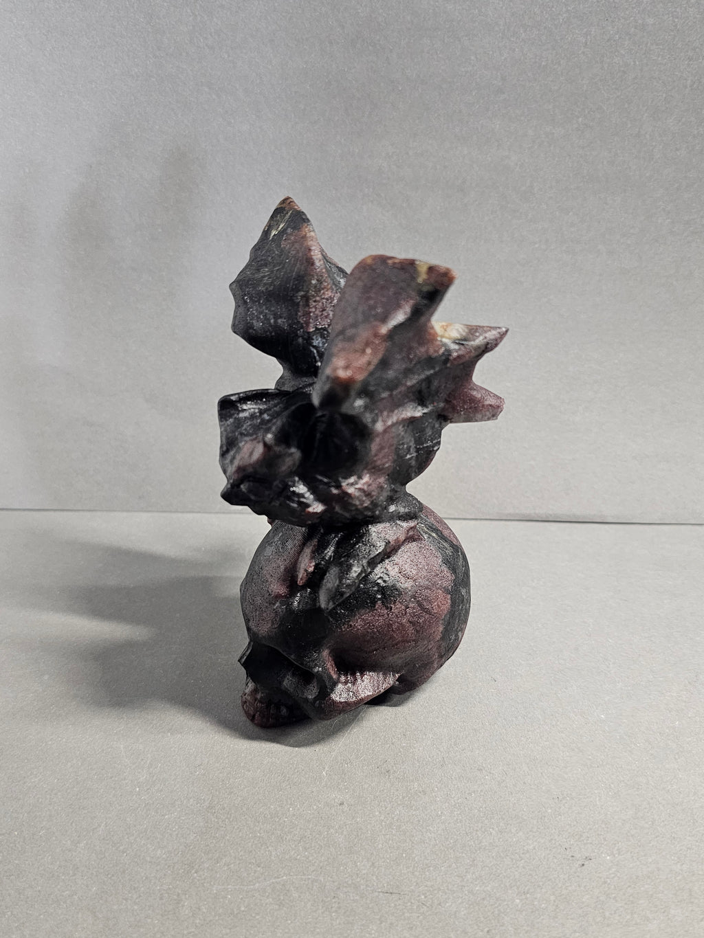 Garnet Astrophyllite Skull with Bat Carving – 4.5 Inch Gothic Crystal Skull