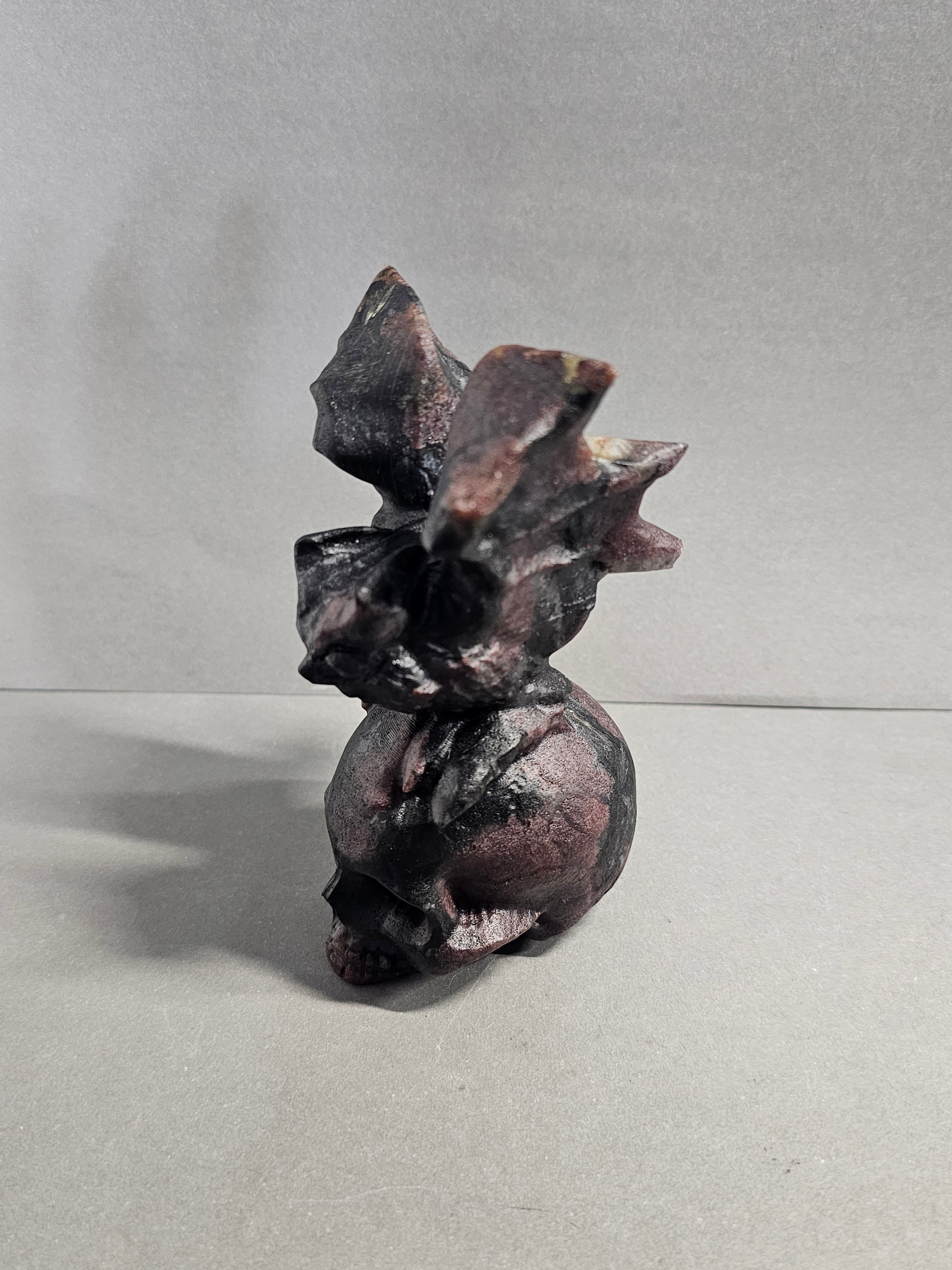 Garnet Astrophyllite Skull with Bat Carving – 4.5 Inch Gothic Crystal Skull