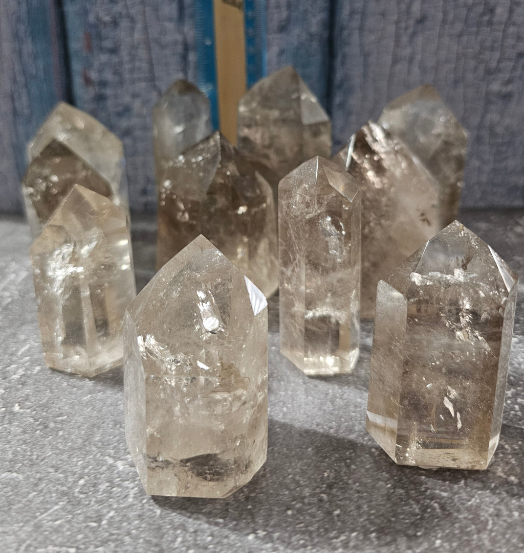 group of 11 light smokey quartz freeform crystal Brazil polished