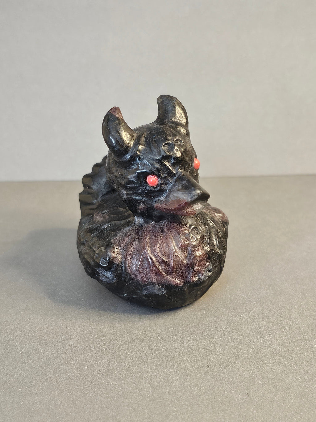 Garnet Arfvedsonite Duck with Horns & Skulls – Dark Whimsical Crystal Carving | 2.5 Inches